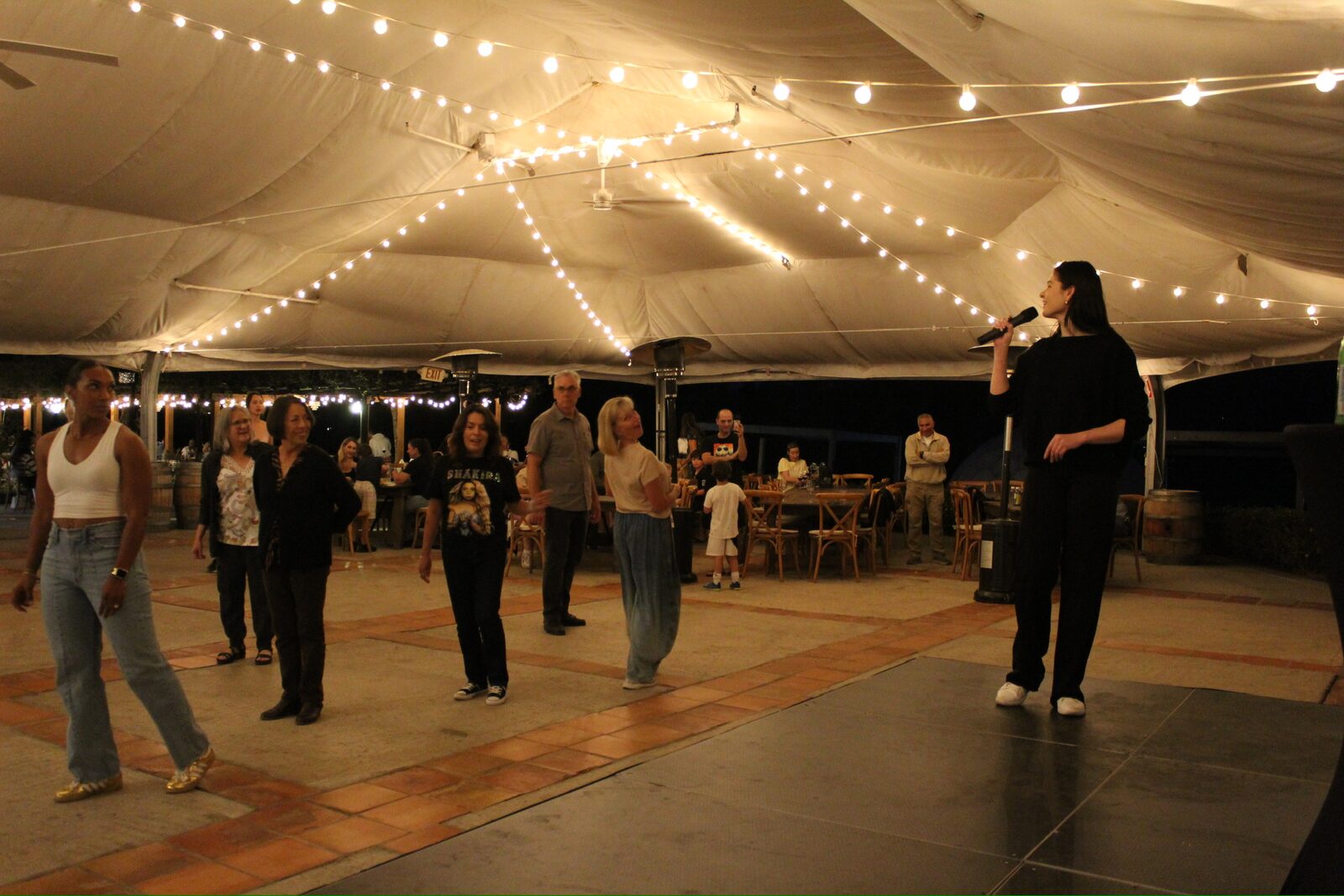 Sophia leading a class at a Leva' Dance Club Latin Night